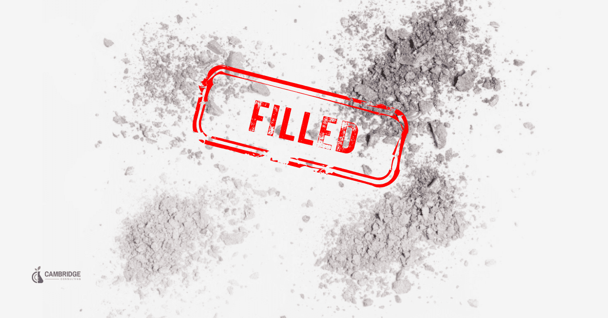 black and white image of powdered makeup with a red stamp overlay that says "filled."