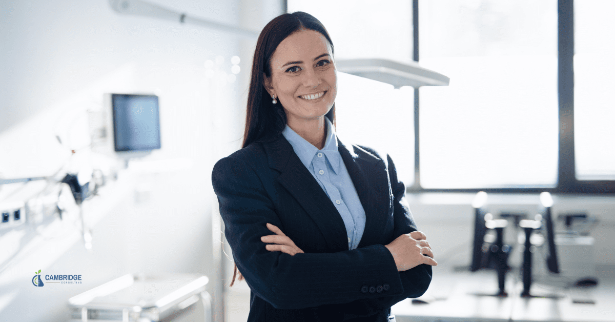 corporate woman standing in an office smiling