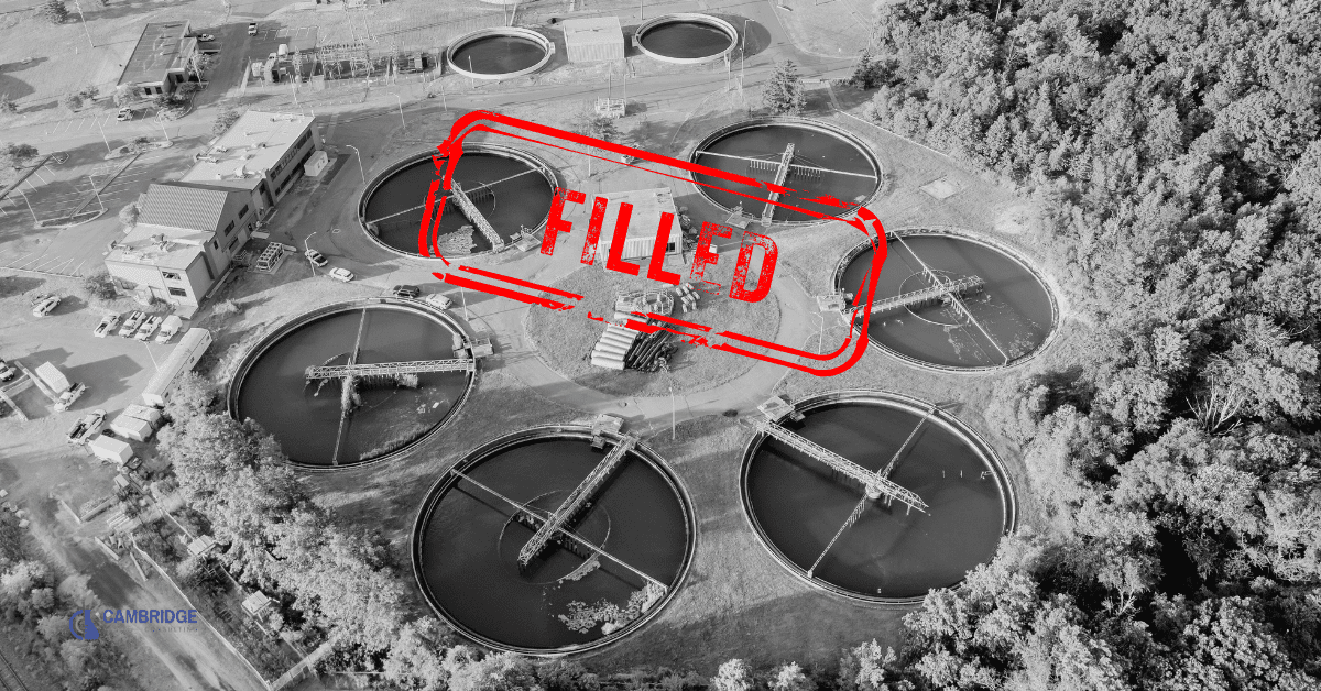 a black and white image of a water treatment plant with a red stamp overlay that says "FILLED"