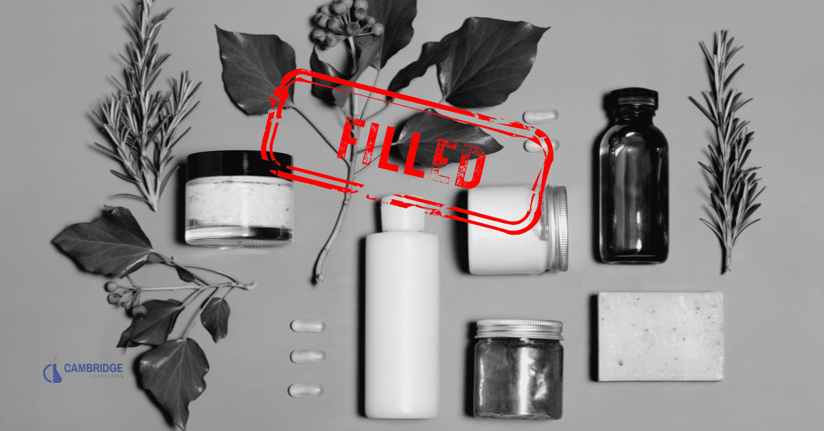a black and white image of an array of personal care products with a red stamp overlay that says filled