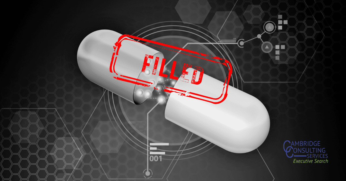 a black and white image of a split open pill with a red stamp overlay that says "filled." The. Cambridge Consulting Services logo is in the bottom right corner