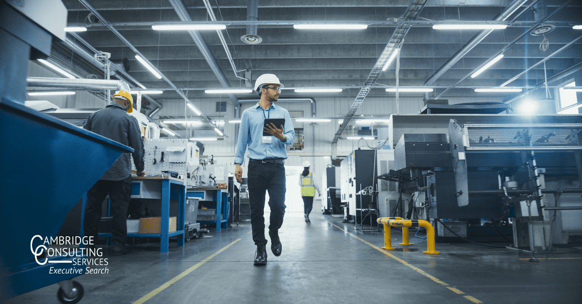a photo of a plant maintenance manager walking through their plant with the cambridge consulting services logo